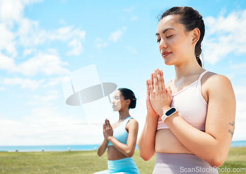 Image of Meditation, fitness and yoga women in park or beach with blue sky mock up for wellness, mindfulness and inner healing. Fitness, calm and pilates friends meditate with peace mindset in nature mockup