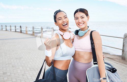 Image of Women after beach workout, portrait of friends with healthy exercise lifestyle in summer and Monaco sidewalk with sports bag. Happy young girls, body fitness by sea together and outdoor gym training