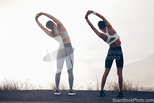 Image of Stretching, fitness and women friends outdoor training for motivation, strength and collaboration on sky mock up. Personal trainer athlete people with workout, exercise or pilates on mountains