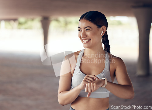 Image of Happy runner woman, smart watch and city fitness, exercise and check training time, progress or goals on digital stopwatch. Smile, music and motivation of sports athlete monitor workout on technology