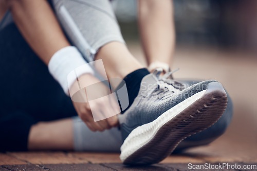 Image of Woman, running shoes and city fitness for workout, exercise and training in wellness health, heart cardio or marathon. Zoom, sports trainers and runner hands ready for urban activity energy or goals