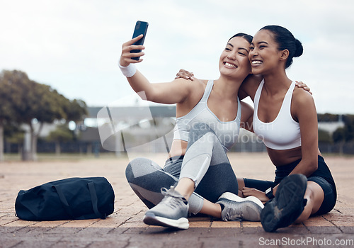 Image of Friends, women and selfie for training in park, urban or outdoor while happy together in city. Smartphone, photo and girl with smile for exercise, wellness and workout for social media in Los Angeles