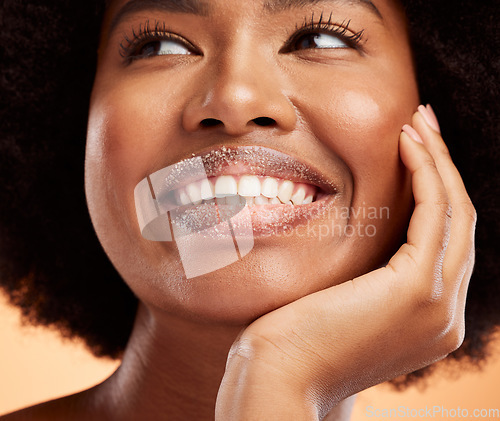 Image of Black woman, lip sugar makeup or skincare health of exfoliate model with smile on orange studio background. Natural healthy, smooth skin and happy with beauty cosmetic hair treatment model