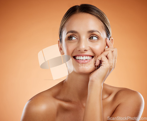 Image of Face, portrait and skincare for beauty woman with smile for facial health against an orange mockup studio background. Cosmetic model happy about natural wellness and dermatology with mock up space