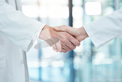 Image of Handshake, doctors meeting or teamwork for partnership, collaboration or support for medical success in hospital. Healthcare, health or shaking hands for thank you, welcome or trust for surgery help