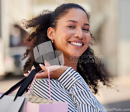 Image of Shopping, rich and woman in urban city for fashion, clothes or retail sale discount and promotion. Store, boutique or mall girl customer portrait and shopping bag for wealth, choice in outdoor street