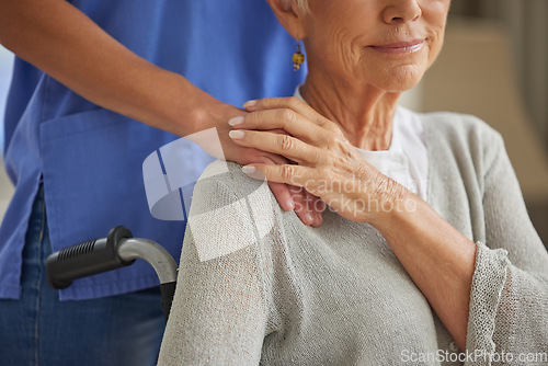 Image of Hand, nurse and elderly woman patient with disability holding hands homecare worker for empathy, kindness and healthcare support. Caregiver, volunteer and trust help for senior woman in wheelchair