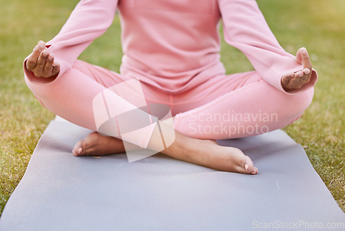 Image of Meditation, grass and body of woman in lotus yoga position for wellness, spiritual balance and zen pilates training. Peace, nature freedom and relax girl meditate for health and chakra energy healing