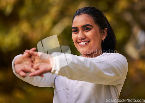 Image of Fitness, exercise and wellness woman stretching and warm up for workout, running and cardio training outdoor in nature. Happy indian athlete female out for a run in a park for a healthy lifestyle