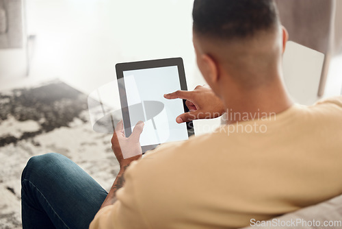 Image of Man, relax sofa and tablet mockup space, marketing or advertising from above in house. Mock up, copy space and male with tech web browsing, social media or internet surfing in home in living room.