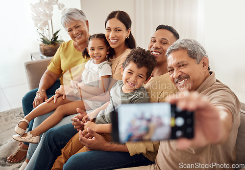 Image of Selfie, family and phone with a senior man taking a photograph with his relatives during a visit in their home. Love, retirement and technology with an elderly male posing for a picture in the house