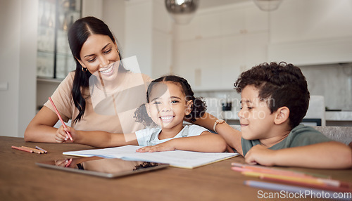 Image of Family, children and education with a girl, boy and mother doing homework or learning at a dining room table of the home. Kids, love and school with a woman teaching her daughter and son in a house