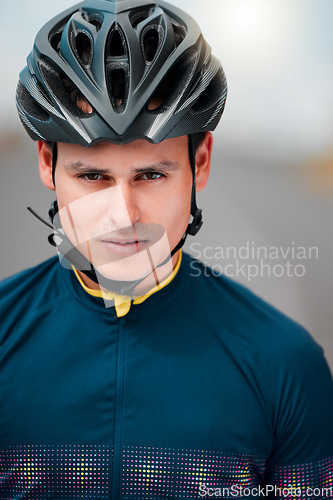 Image of Cycling, helmet and serious with a sports man outside, ready to ride or cycle for exercise and fitness. Workout, training and cardio with a male athlete riding with focus for health or endurance