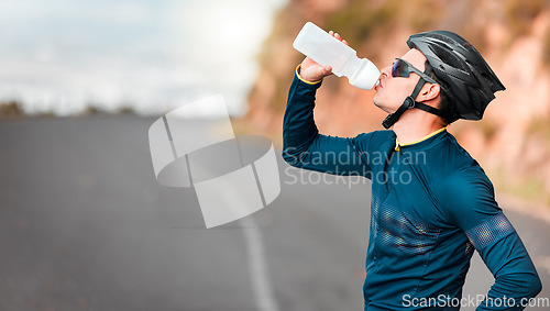 Image of Road, fitness and cycling man drinking water by a mountain tired from workout, cardio exercise and training. Bicycle, sports and thirsty biker refreshing with a healthy beverage or liquid in Texas
