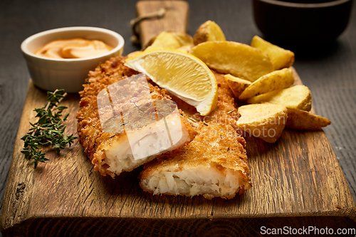 Image of breaded fish fillets and fried potato wedges