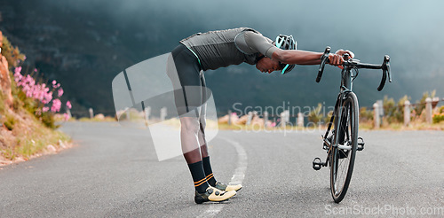 Image of Sports man, stretch and cycling break along mountain route by cyclist resting during fitness, exercise and morning cardio. Stretching, bicycle and black man stop for rest during physical performance