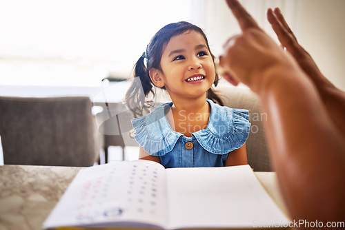 Image of Education, homeschool and a kindergarten girl with smile, notebook and help from mother in math class. Home school, happy child and learning to count on fingers and hands, woman teaching kid maths.