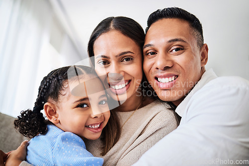 Image of Family, happy and face portrait in living room home, smiling and bonding. Love, care and happy parents, child or girl hugging, embrace or spending quality time together in house with smile or support