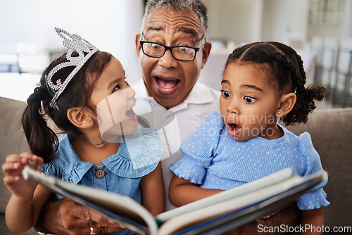 Image of Family, reading book and children with grandpa for wow, surprised and excited expression in a living room with people bonding. Grandfather or man, kids and story time at home with man and girls