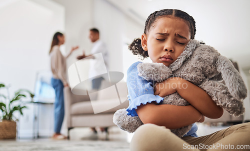 Image of Parents fight, sad girl and teddy hug of a child crying from divorce in a home living room. Depressed kid, problem and youth anxiety of children depression from mama and dad family fighting