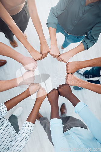 Image of Business people teamwork, fist bump and collaboration, cooperation and trust, goals and support. Above workers hands, diversity team building circle and commitment, vision and job mission of about us