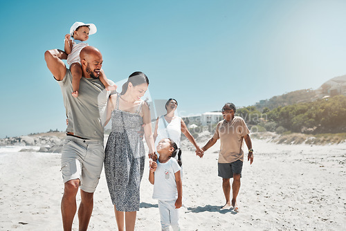 Image of Travel, summer and big family holding hands at beach and walking on vacation, wellness and support together. Smile, love and relax on sea side holiday with happy parents, children and grandparents