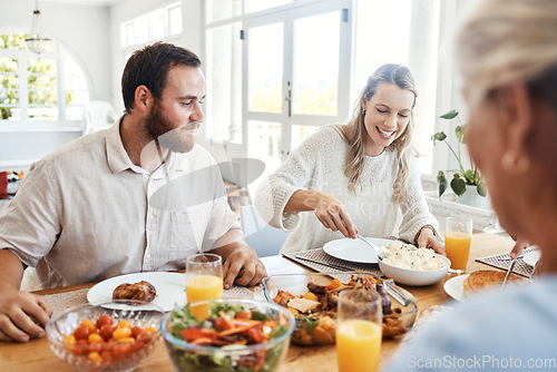 Image of Food, family and couple eating at a table, happy, relax and bonding in their home together. Lunch, happy family and thanksgiving feast with cheerful people sharing a meal, fresh, cheerful and fun