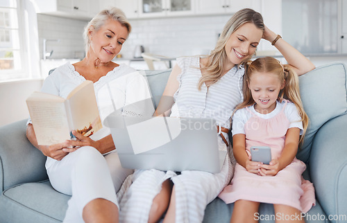 Image of Granny, mother and child bonding, happy and smile in the living room with book, laptop and smartphone on couch. Grandmother, mama and girl have fun, playing and being together in lounge on sofa