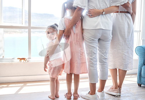 Image of Women, children and generations, rear view at window, back legs and toddler girl looking with smile. Love, support and happy family together in holiday home in Sydney, Australia on first vacation day