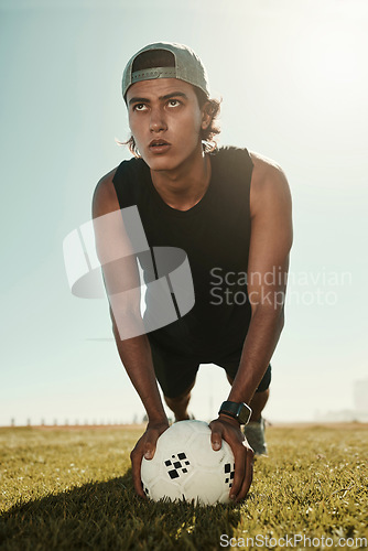 Image of Grass field, fitness workout and soccer core training exercise on an outdoor football field for body or cardiovascular health. Soccer player, focus young man and athlete warmup in Brazil summer sun