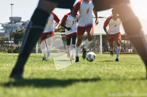 Image of Soccer, team and running for goal in sports motivation and competitive match or game on the field. Athletic football players in teamwork charging opposing side for victory, score or point outside