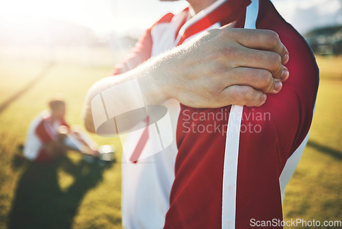 Image of Soccer, athlete and shoulder pain with an injury from a sports match or training on a field. Fitness, football and man with a medical emergency of muscle, joint or bone sprain during an exercise.