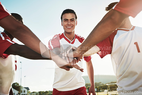 Image of Men soccer team, huddle and hands in support, collaboration and strategy for goals, winning and training on sports field. Portrait happy football player celebrate group motivation of competition game