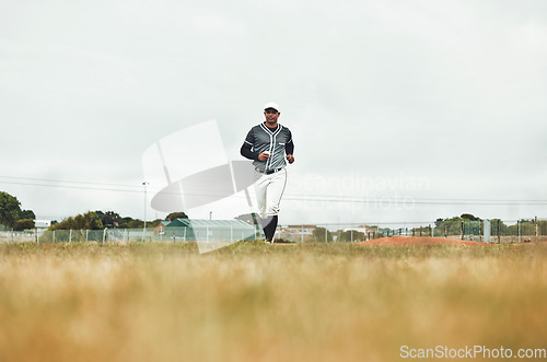 Image of Baseball player running on a baseball field for training, sport and fitness in physical, competitive game. Sports, health and baseball with a man athlete at the start of a match on a field outdoors