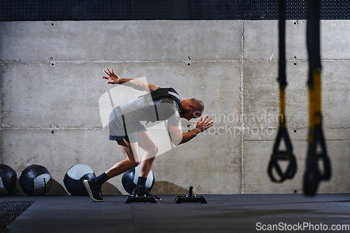 Image of A fit couple in a modern gym, engaging in running exercises and showcasing their athletic prowess with a dynamic start.