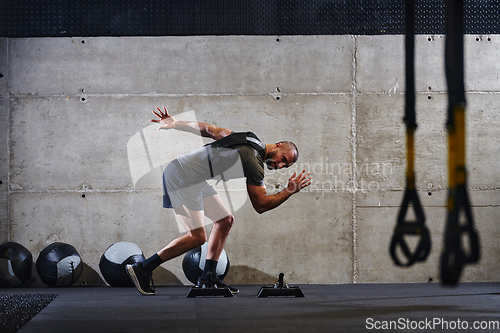 Image of A fit couple in a modern gym, engaging in running exercises and showcasing their athletic prowess with a dynamic start.