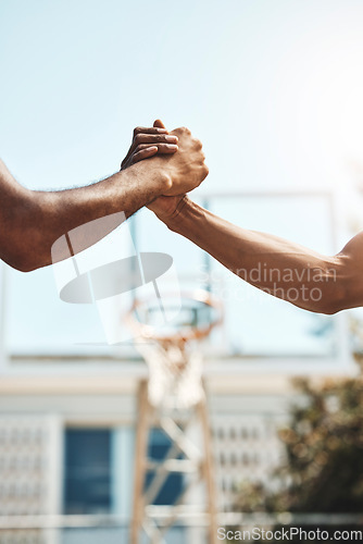 Image of Basketball men handshake before game at sport court for good luck, agreement and support. Sports, fitness and athletes shaking hands to show unity, thank you and agreement for success during match