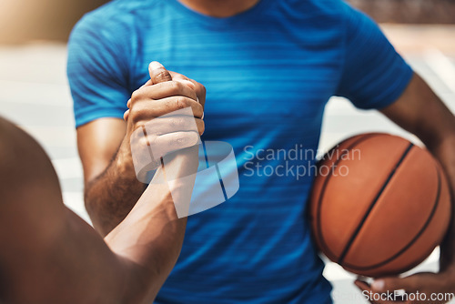 Image of Basketball players, handshake and greeting with ball to celebrate for victory, congratulations and exercise for game. Team, workout and fitness for practice, training and match on court for wellness.