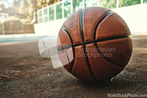 Image of Basketball sport ball in empty basketball court to play, train and practice for tournament game and training. Summer sports exercise and fitness workout training area, nobody or outdoor competition