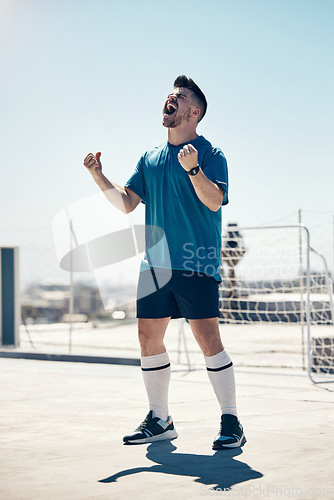 Image of Football, soccer player and athlete man in celebration after winning or scoring a goal at sports match or game in the city. Celebrate, win and champion player happy about performance in urban sport