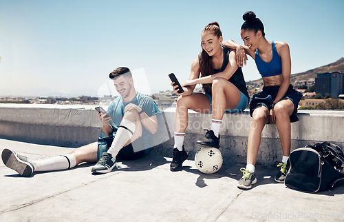 Image of Sport friends, phone and relax in city after exercise and morning cardio, physical exercise and soccer training. Fitness, soccer player and town hangout with diverse people talking after workout