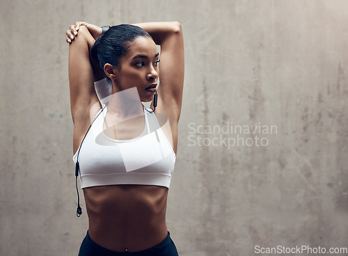 Image of Woman in city, stretching for running exercise and start of morning fitness routine training for cardiovascular health. Black woman athlete, stretch arm muscle by wall and break after sports run