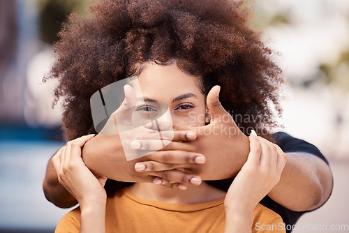 Image of Abuse, depressed and couple with violence in their marriage together in the city. Face of a black woman with anxiety, pain and problem with a man being abusive with trauma, hands for fear and stress