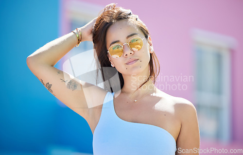 Image of City, fashion and portrait of woman with sunglasses for cool and trendy summer style on holiday. Asian, Gen Z and urban fashionista girl on vacation break in sunlight relaxing with retro glasses.