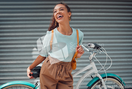 Image of Bicycle, travel and black woman student excited for outdoor lifestyle, eco friendly cycling transport on garage door background. Gen z girl with bike and backpack on her way to college or university