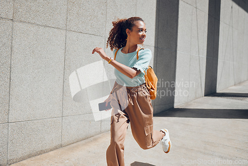 Image of Woman, travel and city with backpack, running and street for holiday, vacation or traveling. Black woman, tourist and outdoor in urban, metro or town in summer, sunshine and smile in Cape Town