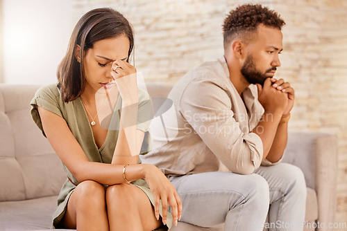 Image of Fight, divorce and depression with couple on sofa for conflict, therapy and mental health or marriage counseling. Sad, anxiety and stress with man and woman in living room for fail, crisis and angry
