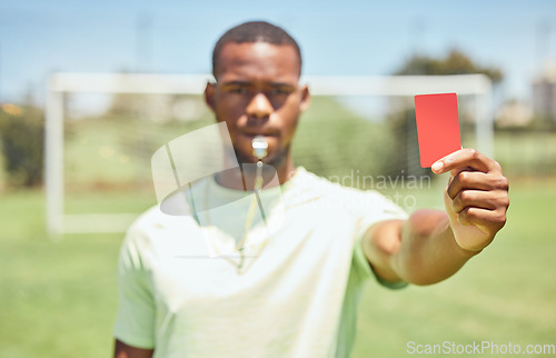 Image of Soccer, referee and red card on the field during a sports match or training for fitness. Workout, sport and football umpire blowing a whistle for a penalty or wrong move during a game on the pitch.