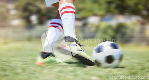 Image of Soccer, grass and legs kick a football in a training game, practice workout and sports match on soccer field. Fitness, shoes and soccer player in action playing in cardio exercise outdoors in Brazil