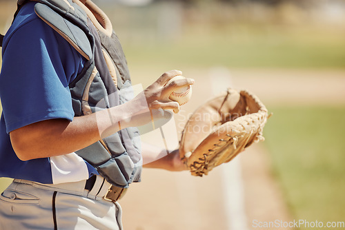 Image of Baseball pitcher, sports and man athlete with ball and glove ready to throw at game or training. Fitness, exercise and professional male softball player practicing to pitch for match on outdoor field